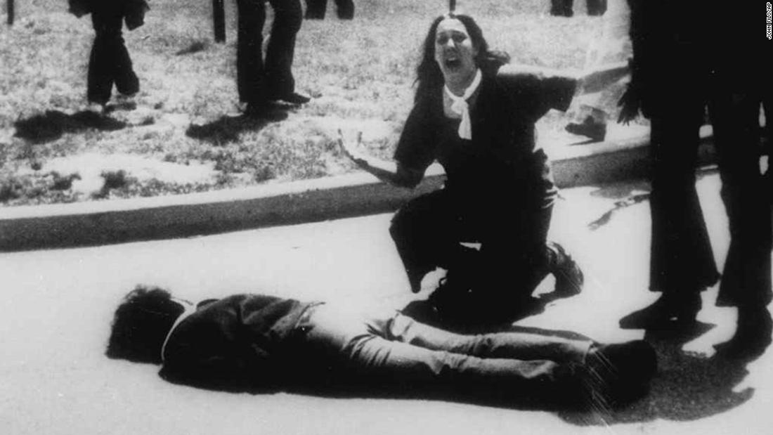 Mary Ann Vecchio gestures and screams as she kneels by the body of a student lying face down on the campus of Kent State University on May 4, 1970.