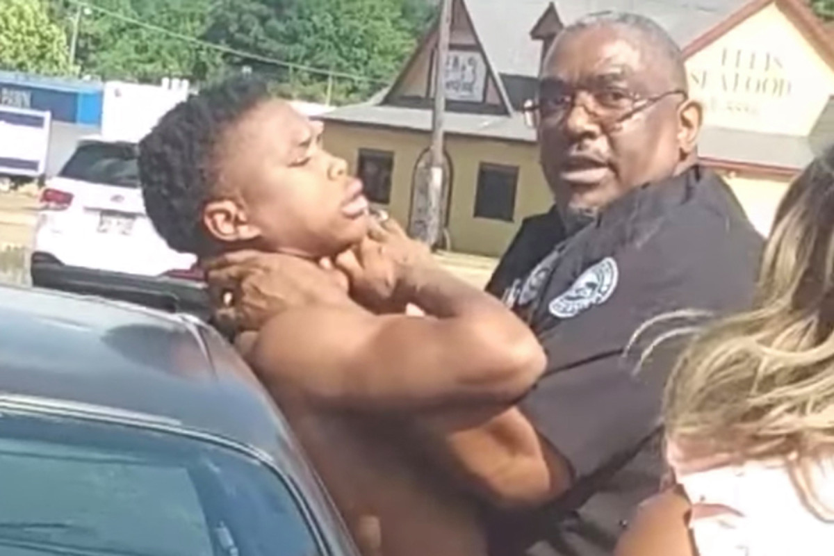 In a later release of the video, the Mississippi policeman shows his hands on the man's neck