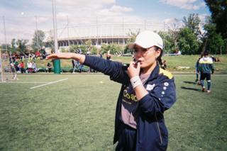A coach poses for the camera