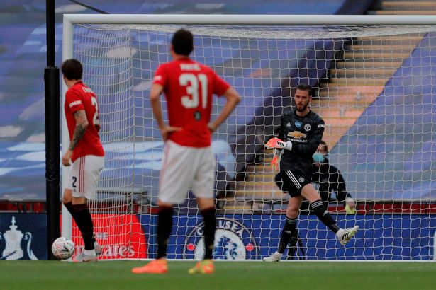 The United keeper kicks the ball away after Chelsea doubled their lead