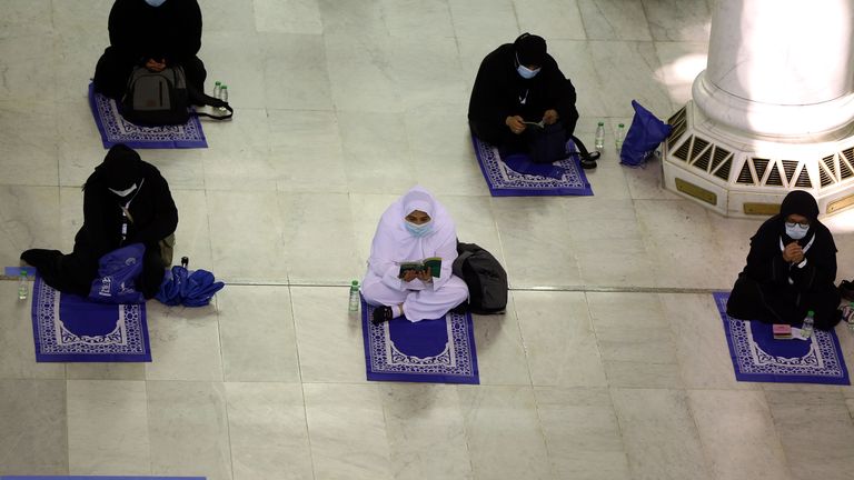 Socially-distanced pilgrims pray at the Grand Mosque in Mecca
