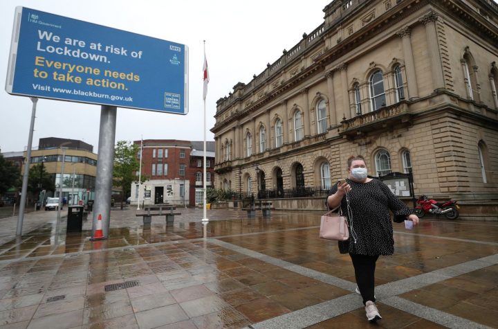 A warning from the government is seen outside Blackburn Town Hall