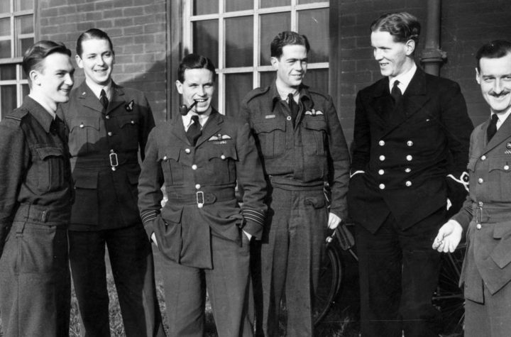 Wing Commander Guy Gibson (smoking a pipe) led the Dambusters raid in 1943