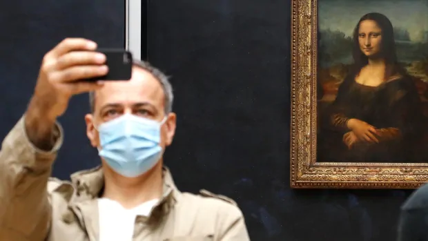 Mona Lisa back at work as Louvre reopens in Paris