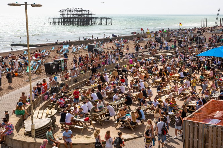 ? Licensed to London News Pictures. 01/08/2020. Brighton, UK. Thousands of people take to the beach in Brighton and Hove as sunny weather hits the seaside resort. Photo credit: Hugo Michiels/LNP
