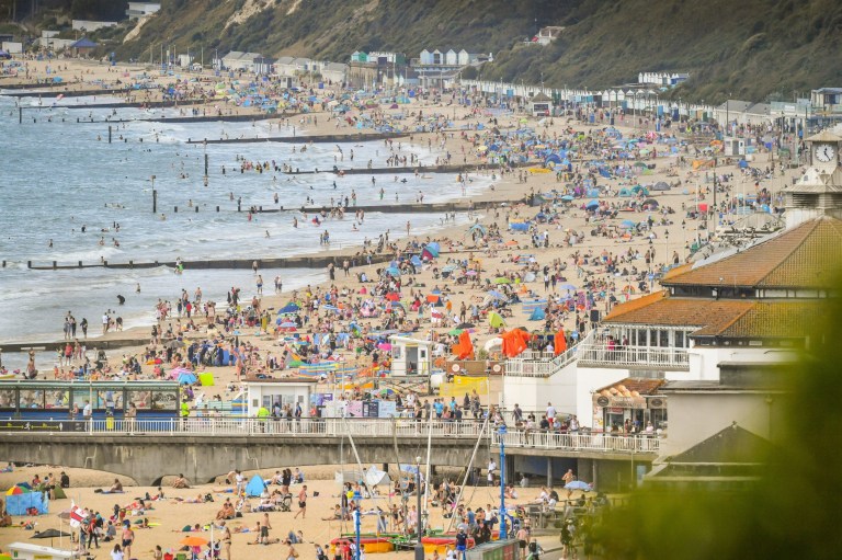 People enjoy the hot weather on the beach at Bournemouth. PA Photo. Picture date: Saturday August 1, 2020. Photo credit should read: Ben Birchall/PA Wire
