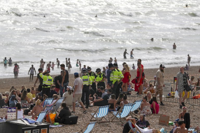 Police patrol the beach as people enjoy the hot weather on Brighton beach in Sussex. PA Photo. Picture date: Saturday August 1, 2020. Photo credit should read: Steve Parsons/PA Wire