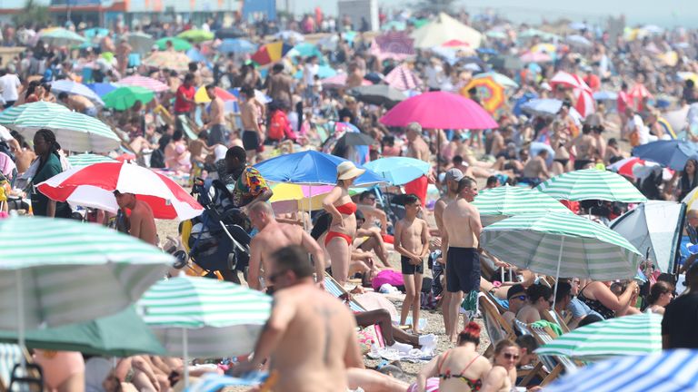 People enjoying the hot weather at Southend beach in Essex