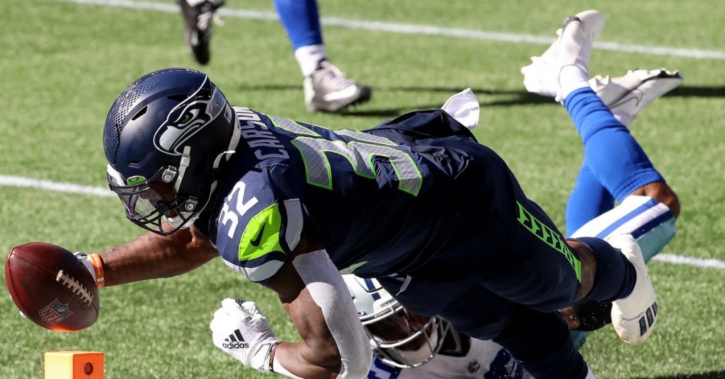 Chris Carson Injury: Seahawks RB suffers a knee sprain after Tristan Hill deliberately twisted his leg