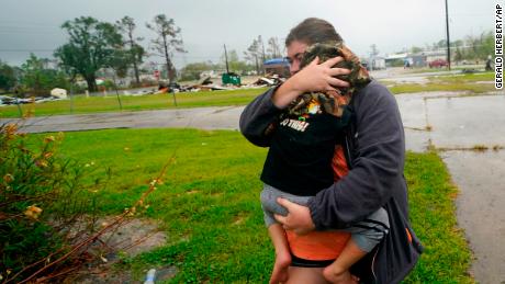 On Friday, October 9, 2020, at Lake Charles, Louisiana, before the Delta hurricane, Daniel Fontaine goes to a relative's house in the rain with his son Hunter.