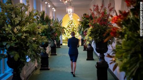 A military aide walks through the eastern colonnade as it decorates for Christmas at the White House on November 30, 2020. 