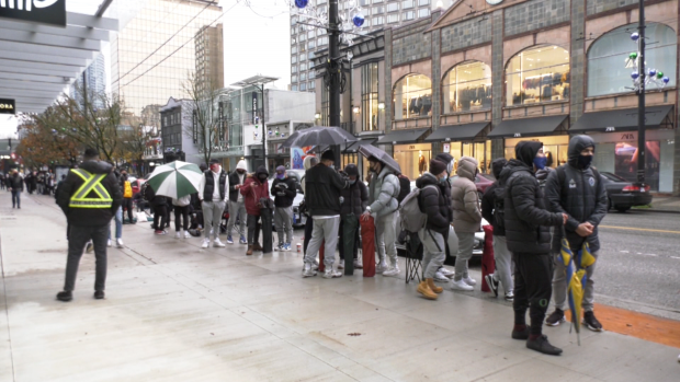 The foot locker launch attracts spectators in downtown Vancouver
