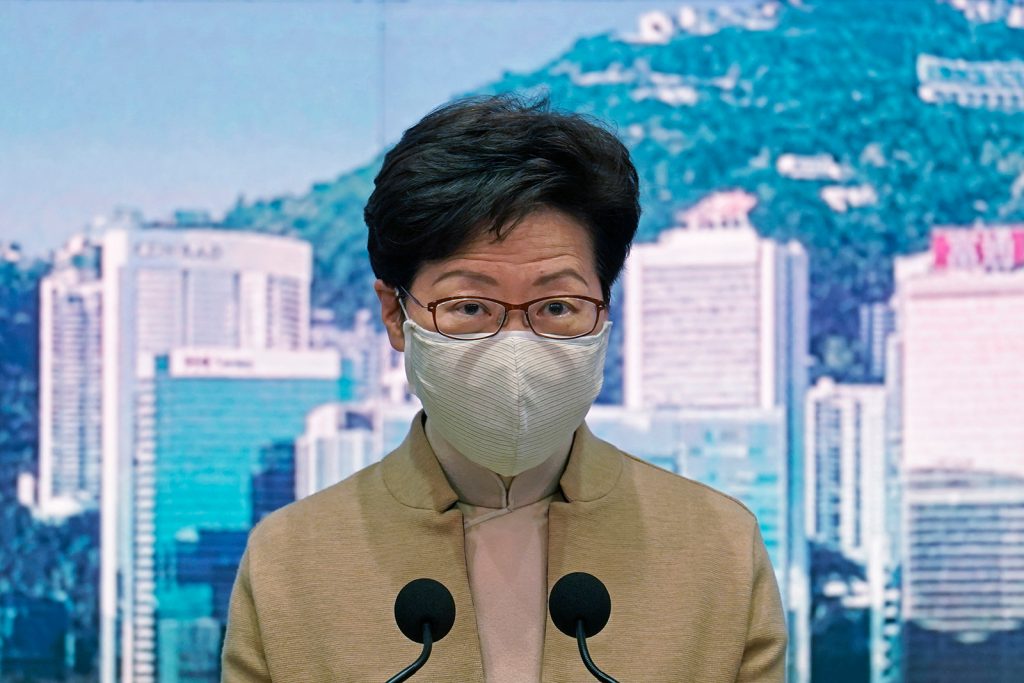 Hong Kong Chief Executive Carrie Lam wearing a face mask speaks during a press conference in Hong Kong, on December 8.