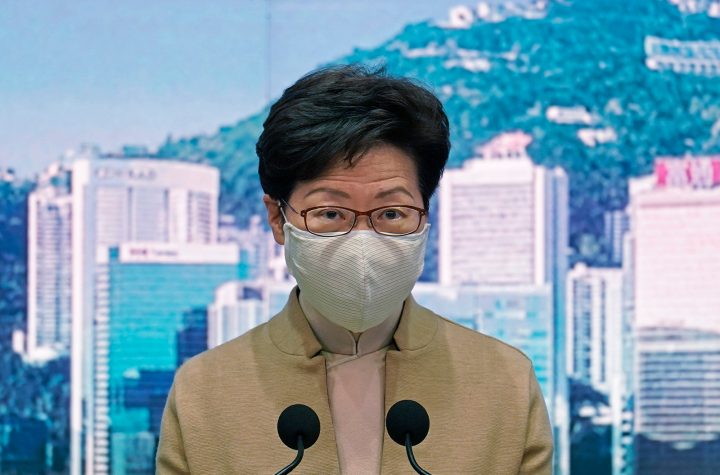 Hong Kong Chief Executive Carrie Lam wearing a face mask speaks during a press conference in Hong Kong, on December 8.