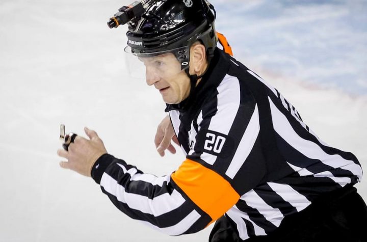 NHL Referee Tim Peel shows the door