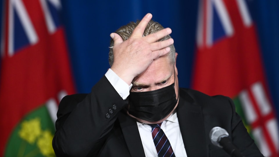 Premier Doug Ford held his head at a press conference.