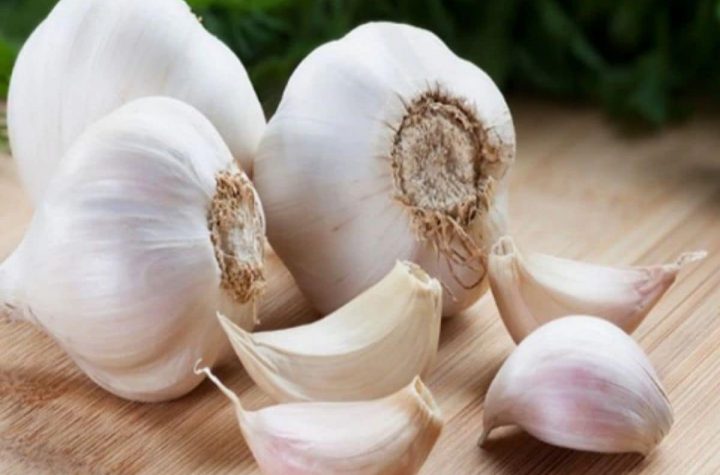 The woman puts garlic cloves in the nostrils to clear the nose