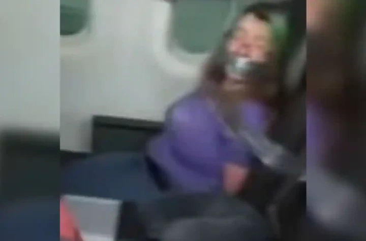 She was fined $ 82,000 after being forced into a plane seat