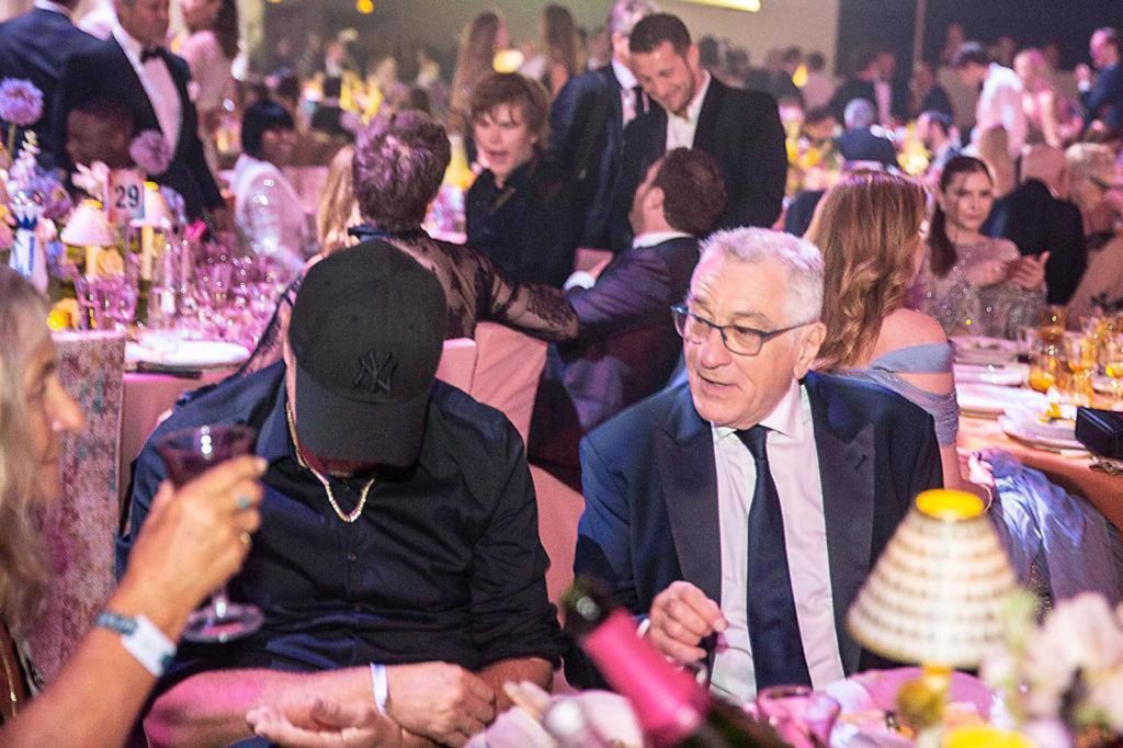 DiCaprio agnostic, in the eyes of De Niro ... at the behind-the-scenes amfAR dinner