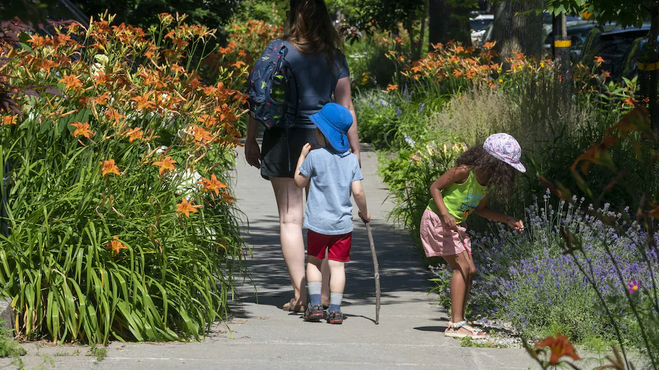     Children among flowers.