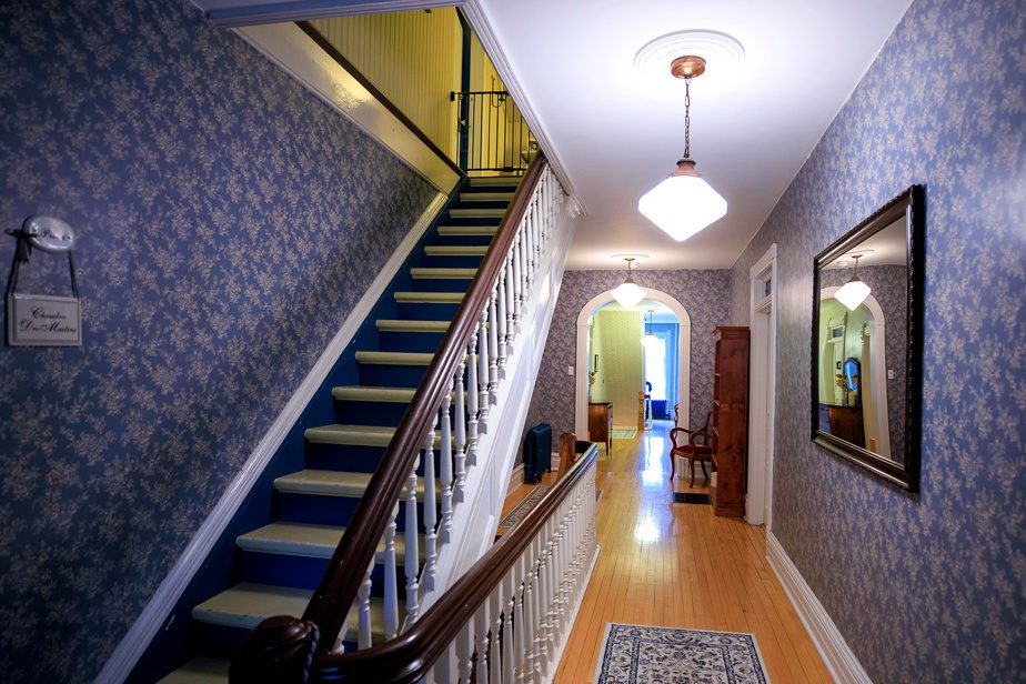 Corridors and stairwells clad in romantic wallpaper transport visitors to another era.