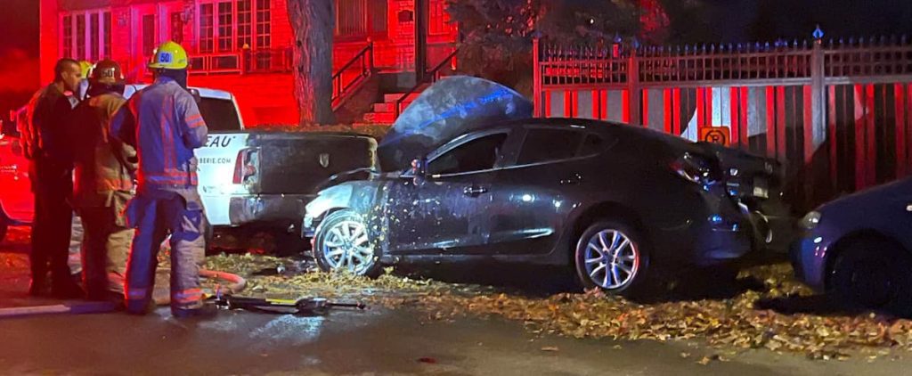 His car, parked on a pile of leaves, caught fire