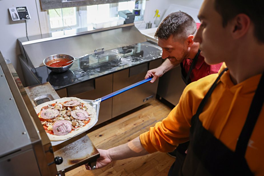 An old dining room has been converted into a kitchen with a pizza oven imported from Italy.  Friends and people in the community helped the family in many ways. 