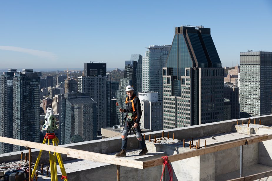 Yolande Rompre, a surveyor, oversees the installation of anchors for the aluminum and glass curtain wall, whose surface spans over 43,070 square meters.  National Bank is building the tallest office building since 1000 De La Gauchetiere and 1250 René-Lévesque Boulevard. 