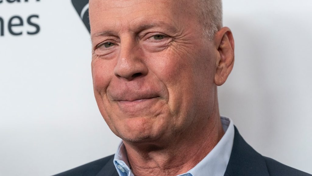 Bruce Willis is surrounded by his family for a rare Christmas photo