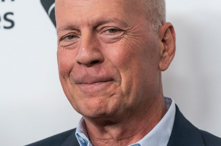 Bruce Willis is surrounded by his family for a rare Christmas photo