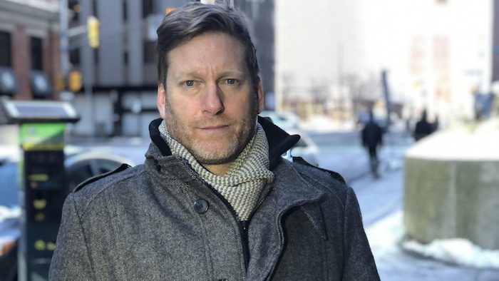 Image of man outside in winter in downtown Ottawa.