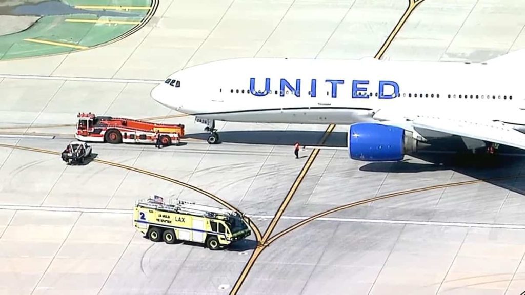 A Boeing 777 makes an emergency landing after a flat tire