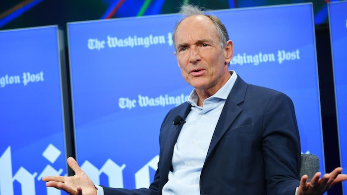 Tim Berners-Lee gave an interview to the Washington Post, sitting in a chair on stage.