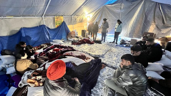 Inside a large tent sat foreign students and workers.